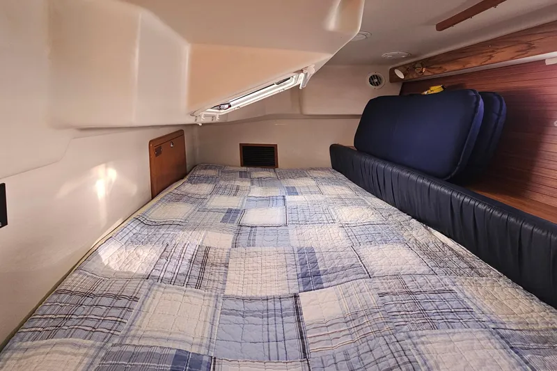 Slide: The Image of Cozy cabin interior of 2006 Catalina 42 MkII sailboat with quilted bedding. - 34
