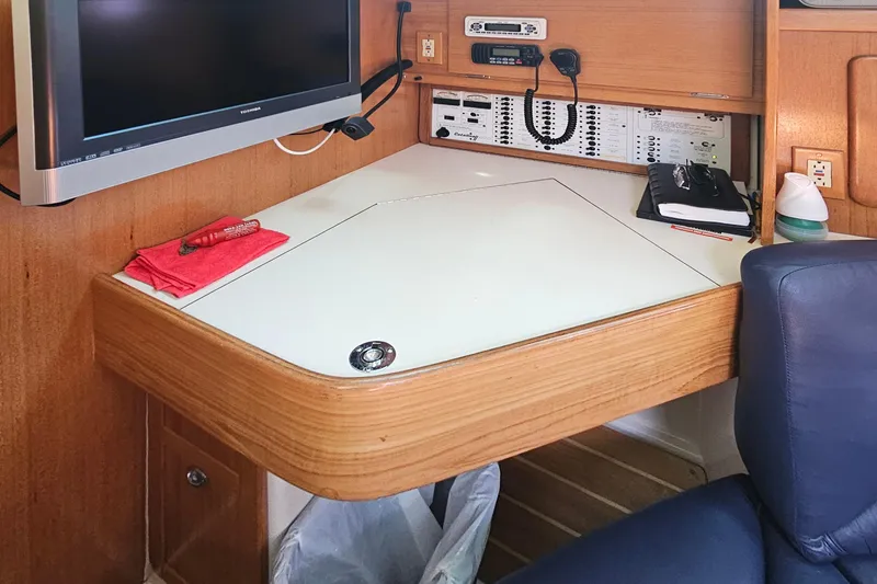 Slide: The Image of Navigation station in a 2006 Catalina 42 MkII yacht with electronics and TV. - 36