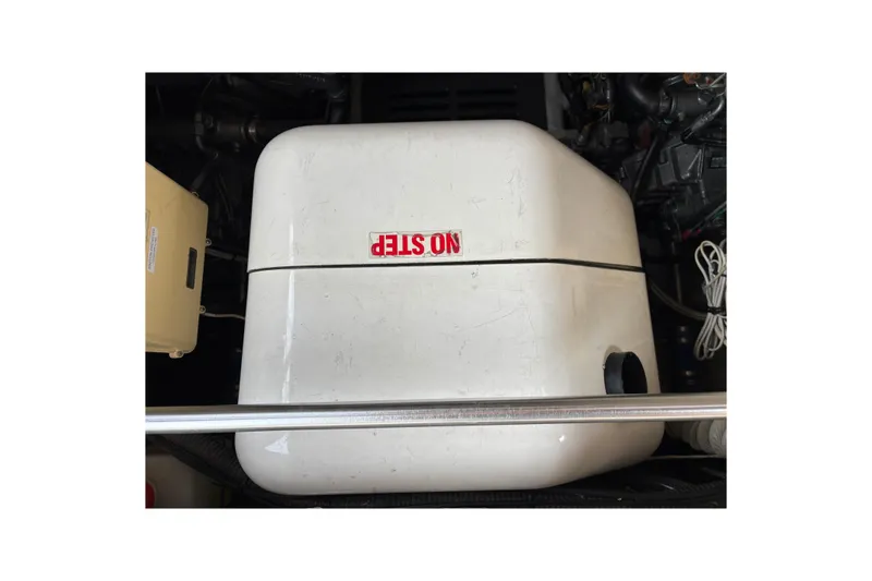 Slide: The Image of Engine compartment of 2006 Mainship Pilot 34 Sedan with "NO STEP" label. - 8