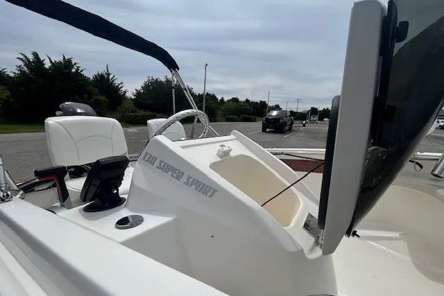 Slide: The Image of 2020 Boston Whaler 130 Super Sport boat interior with steering wheel and console. - 10