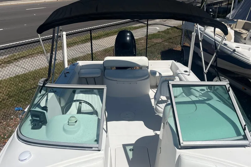 Slide: The Image of 2007 NauticStar 2000XSDC Offshore boat with canopy and dual consoles. - 3