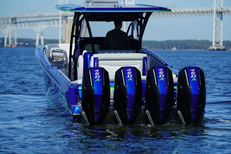 Slide: The Image of 2023 Nor-Tech 390 Sport Center Console with quad 450R engines on water. - 13