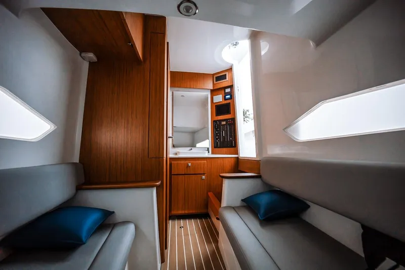 Slide: The Image of Manufacturer Provided Image: Luxurious interior of 2026 Jupiter 40 yacht with modern wood finish and seating. - 10