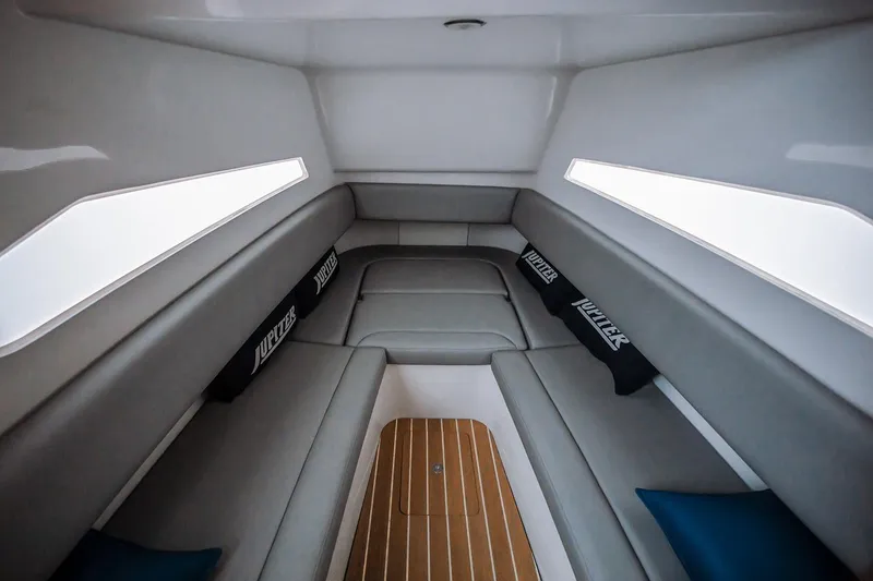 Slide: The Image of Manufacturer Provided Image: Interior of 2026 Jupiter 40 boat, featuring sleek seating and modern design. - 12