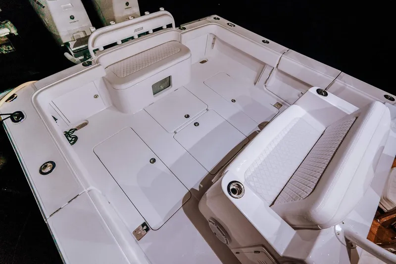 Slide: The Image of Manufacturer Provided Image: Spacious deck of 2026 Jupiter 40 boat with seating and storage compartments. - 8