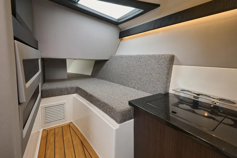 Slide: The Image of Manufacturer Provided Image: Interior of 2025 Cobalt R33 Surf boat with modern seating and kitchenette. - 11