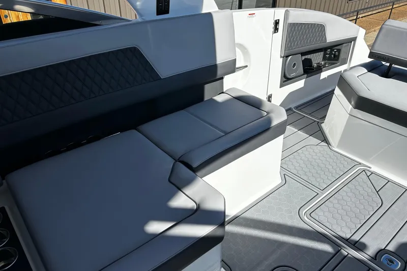 Slide: The Image of Interior of 2025 Cobalt R33 Surf boat with sleek seating and modern design. - 13