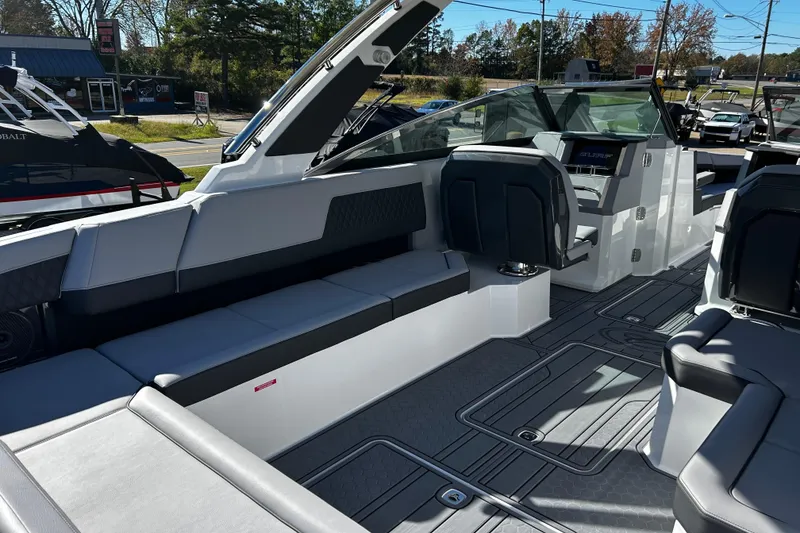 Slide: The Image of 2025 Cobalt R33 Surf boat interior with sleek seating and modern dashboard design. - 14