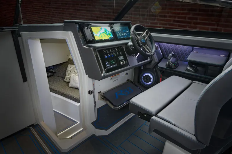 Slide: The Image of Manufacturer Provided Image: Interior of 2025 Cobalt R33 Surf boat with modern dashboard and seating. - 28
