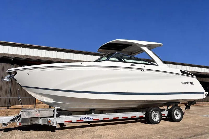 Slide: The Image of Cobalt R33 Surf 2025 on trailer outside warehouse. - 3