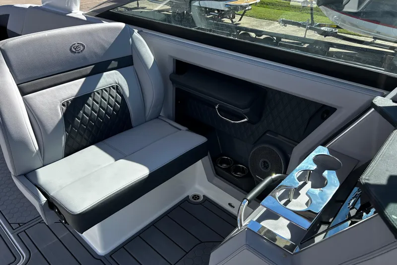Slide: The Image of Luxurious interior of 2025 Cobalt R33 Surf boat with premium seating and cup holders. - 8