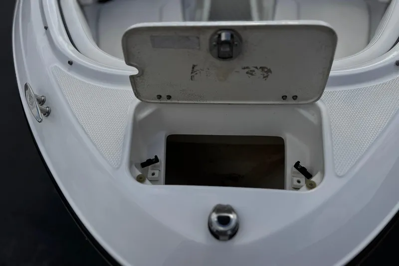 Slide: The Image of Open storage compartment on 2020 Chaparral 21 Surf boat deck. - 12