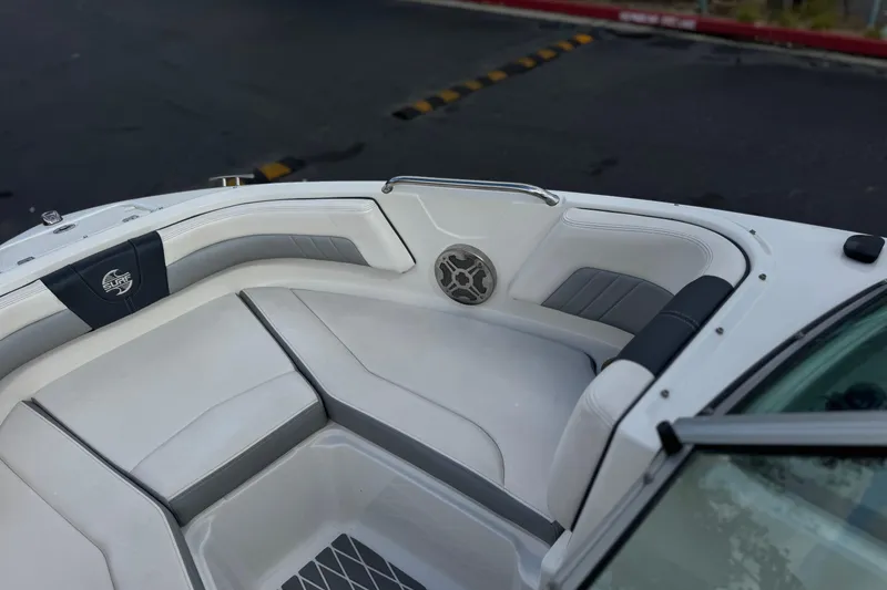 Slide: The Image of Interior of 2020 Chaparral 21 Surf boat with white and gray seating. - 15