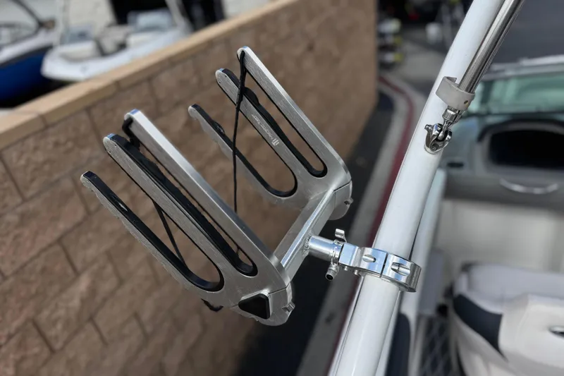 Slide: The Image of Wakeboard rack on a 2020 Chaparral 21 Surf boat, mounted securely on a metal pole. - 18