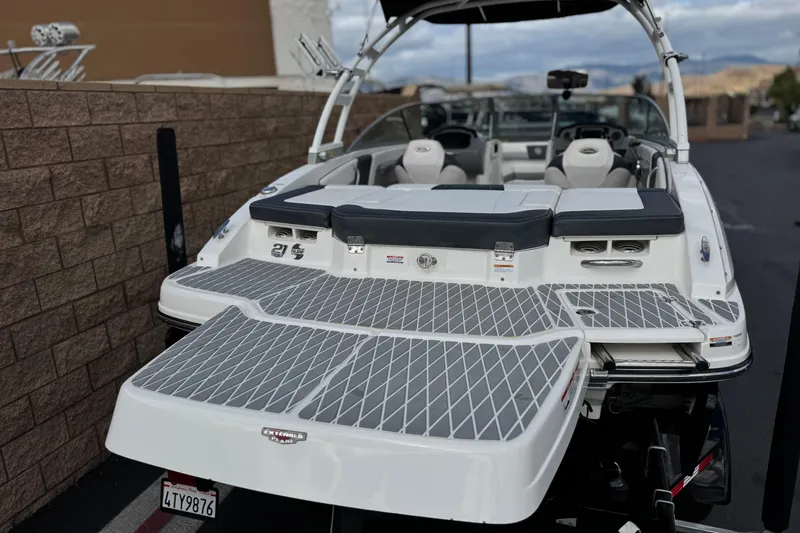 Slide: The Image of 2020 Chaparral 21 Surf boat with spacious swim platform and sleek design. - 6