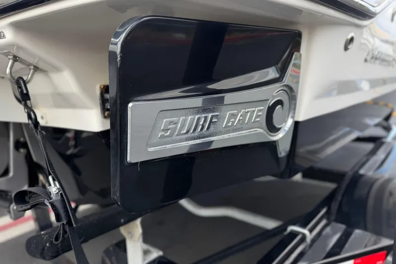 Slide: The Image of 2020 Chaparral 21 Surf boat with Surf Gate feature, enhancing wake surfing experience. - 8