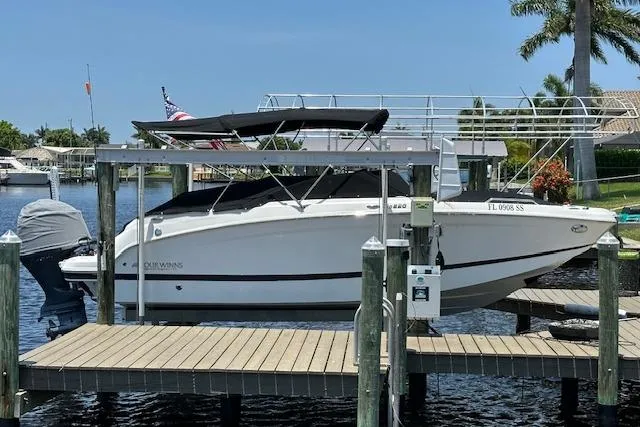 Slide: The Image of 2020 Four Winns HD220 OB boat docked on a sunny day. - 16