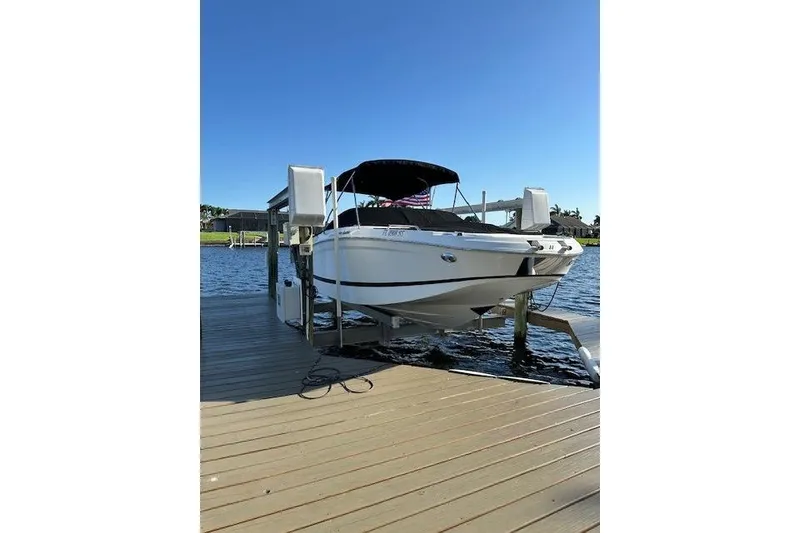 Slide: The Image of 2020 Four Winns HD220 OB boat docked on a sunny day. - 20