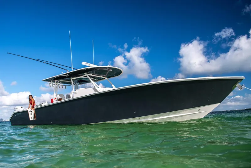 Slide: The Image of Manufacturer Provided Image: 2026 Jupiter 43 boat on clear water under blue sky. - 2