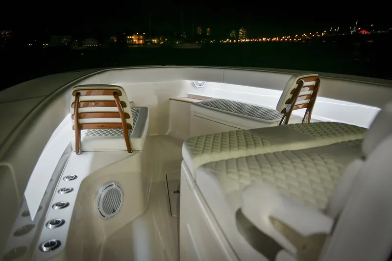 Slide: The Image of Manufacturer Provided Image: Luxurious 2026 Jupiter 43 boat interior with elegant seating and ambient lighting at night. - 4