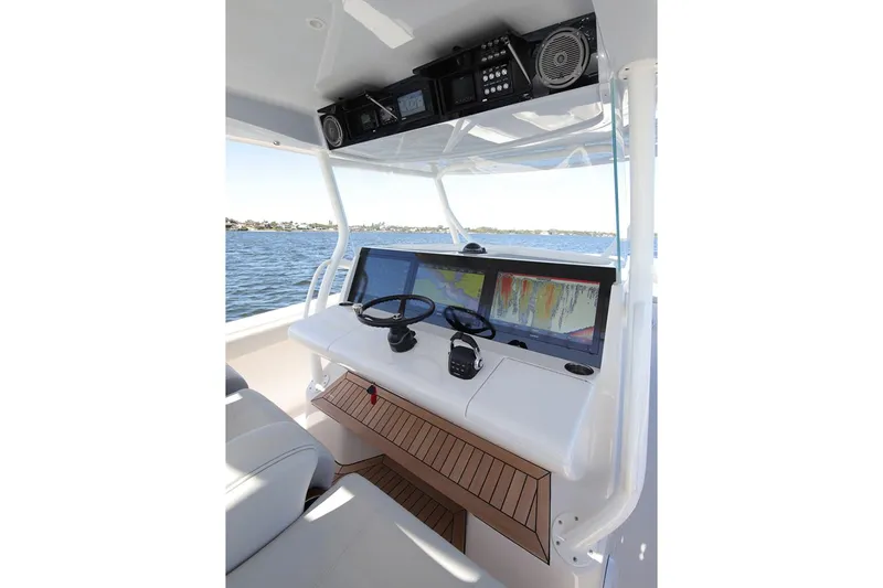 Slide: The Image of Manufacturer Provided Image: 2026 Jupiter 43 boat cockpit with dual steering wheels and advanced navigation system. - 5
