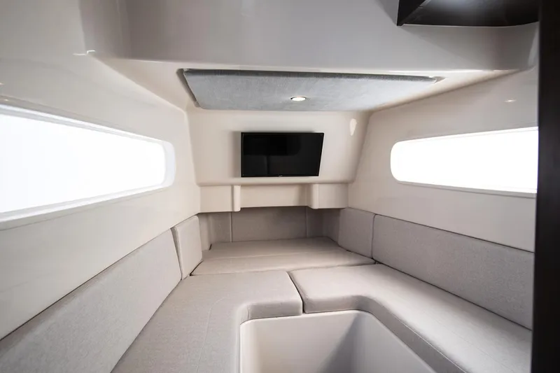 Slide: The Image of Manufacturer Provided Image: Luxurious interior of 2026 Jupiter 43 yacht with modern seating and TV. - 8