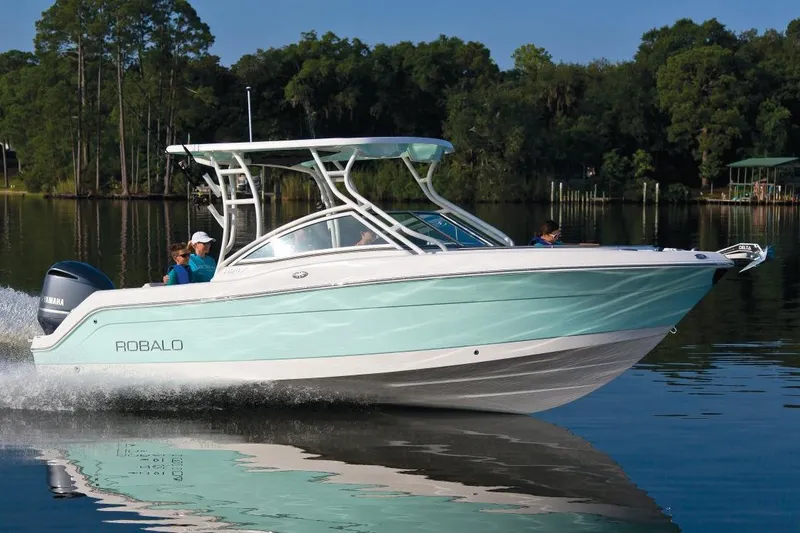 Slide: The Image of Manufacturer Provided Image: 2018 Robalo R247 Dual Console boat cruising on a calm lake. - 22