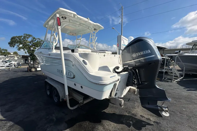 Slide: The Image of 2018 Robalo R247 Dual Console boat with Yamaha outboard motor on trailer. - 4