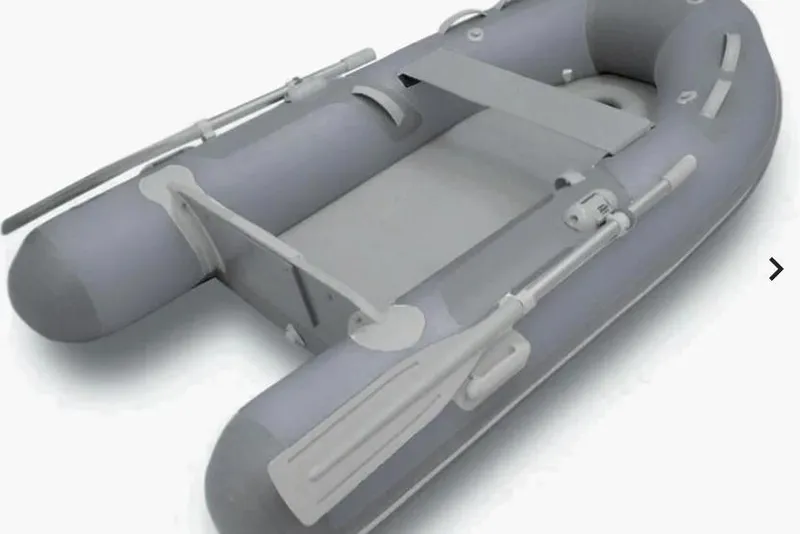 The Image of 2026 Zodiac Cadet 270 Aero inflatable boat, gray with oars, ideal for water adventures. - 0