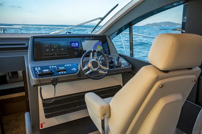 Slide: The Image of Schaefer 600 yacht cockpit 2027 with modern helm station. - 11