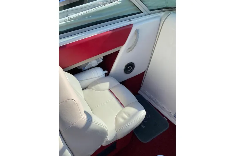 Slide: The Image of Interior of a 1995 Chaparral 2335 SS boat with white and red seating. - 3