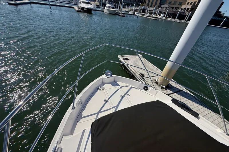 Slide: The Image of Bow view of 2022 Regal 42 FXO yacht docked at marina. - 17