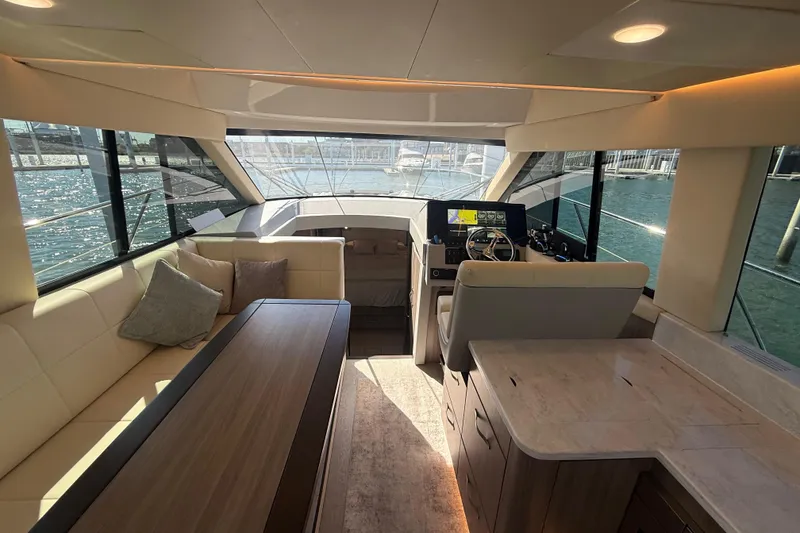 Slide: The Image of Luxurious interior of 2022 Regal 42 FXO yacht with modern helm and seating area. - 19