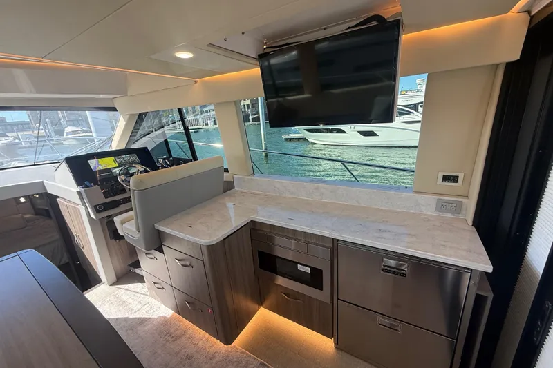 Slide: The Image of Luxurious interior of 2022 Regal 42 FXO yacht with modern helm and galley area. - 20