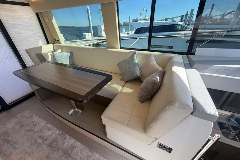 Slide: The Image of Luxurious interior of 2022 Regal 42 FXO yacht with elegant seating and table. - 22
