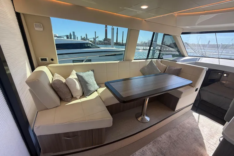 Slide: The Image of Luxurious interior of 2022 Regal 42 FXO yacht with elegant seating and table. - 23