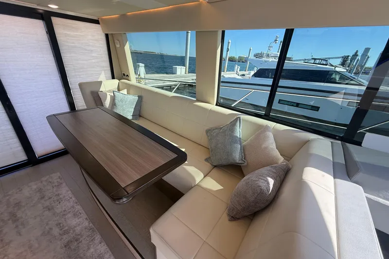 Slide: The Image of Luxurious interior of 2022 Regal 42 FXO yacht with elegant seating and waterfront view. - 24