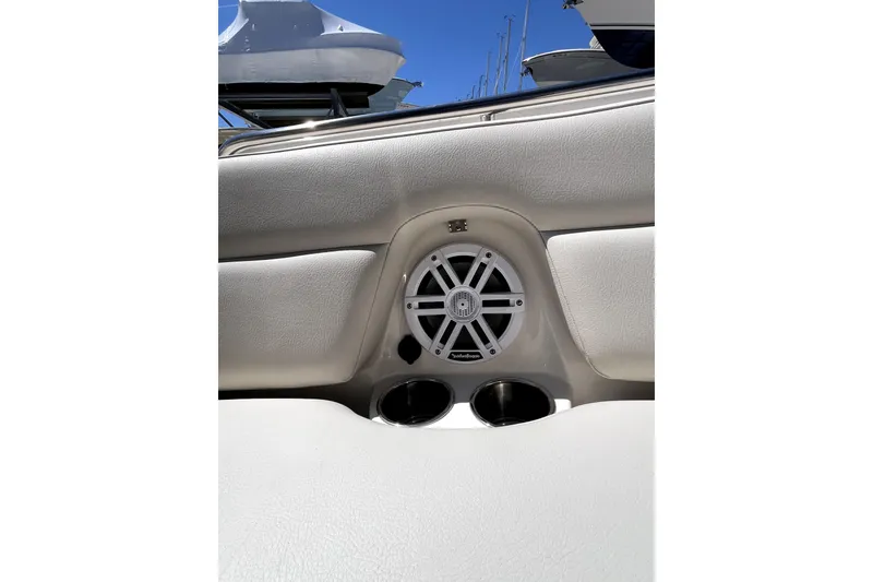 Slide: The Image of 2024 Sailfish 245 DC boat interior with speaker and cup holders. - 41