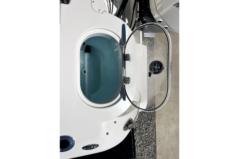 Slide: The Image of Open hatch on 2024 Sailfish 245 DC boat, showcasing interior compartment. - 28