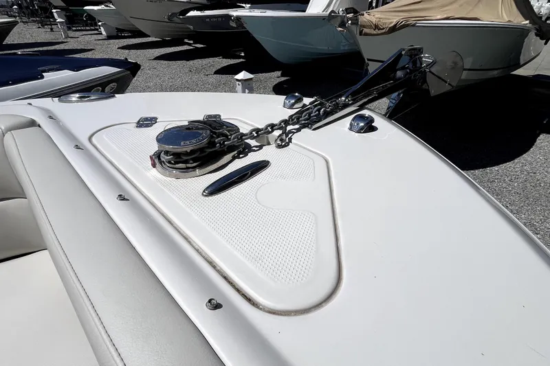 Slide: The Image of 2024 Sailfish 245 DC boat anchor and chain on deck, displayed outdoors. - 42