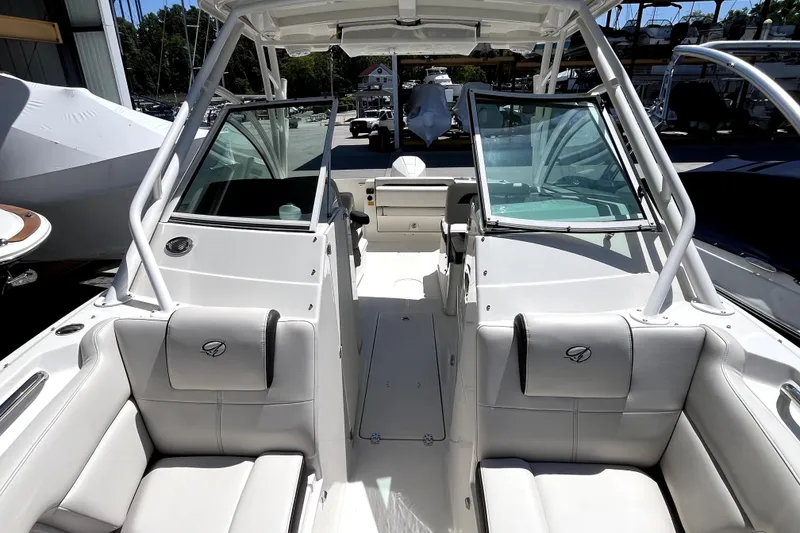 Slide: The Image of 2024 Sailfish 245 DC boat interior with seating and open windshield. - 17