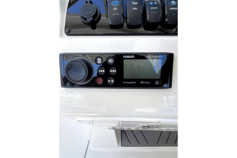 Slide: The Image of Fusion MS-RA70NSX stereo system on 2024 Sailfish 245 DC boat dashboard. - 36