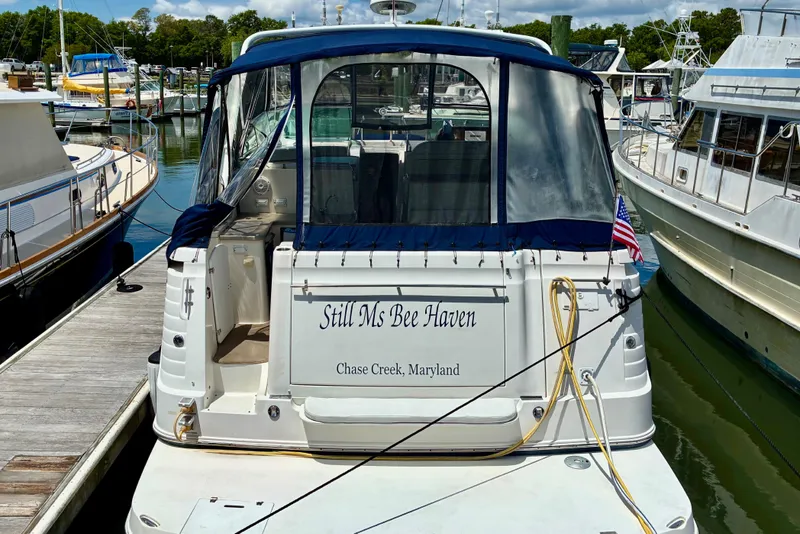 Slide: The Image of 2006 Rinker 390 Express Cruiser docked, named "Still Ms Bee Haven," Chase Creek, Maryland. - 4