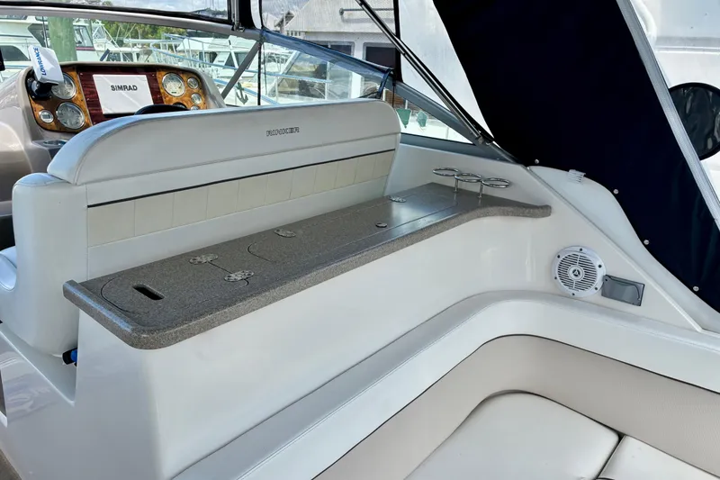 Slide: The Image of 2006 Rinker 390 Express Cruiser interior with helm, seating, and control panel. - 7