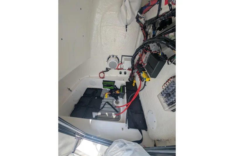Slide: The Image of Interior view of 2026 Tidewater 2300 Carolina Bay boat's electrical system and wiring. - 10