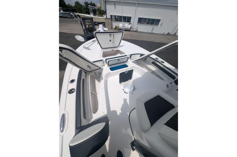 Slide: The Image of 2026 Tidewater 2300 Carolina Bay boat interior with open storage compartments. - 4