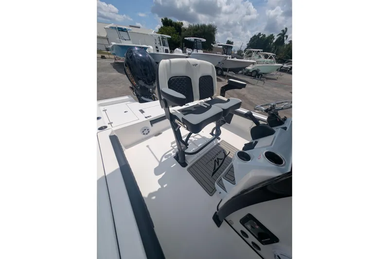 Slide: The Image of 2026 Tidewater 2300 Carolina Bay boat interior with seating and steering console. - 5