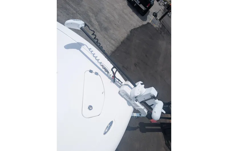 Slide: The Image of 2026 Tidewater 2300 Carolina Bay boat with mounted trolling motor on deck. - 8