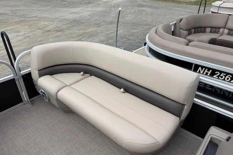 Slide: The Image of 2025 Sun Tracker Party Barge 16 DLX with beige seating on a pontoon boat. - 48