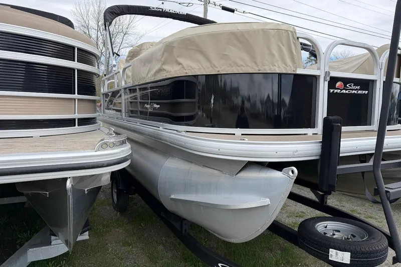Slide: The Image of 2025 Sun Tracker Party Barge 16 DLX pontoon boat, docked and covered. - 55